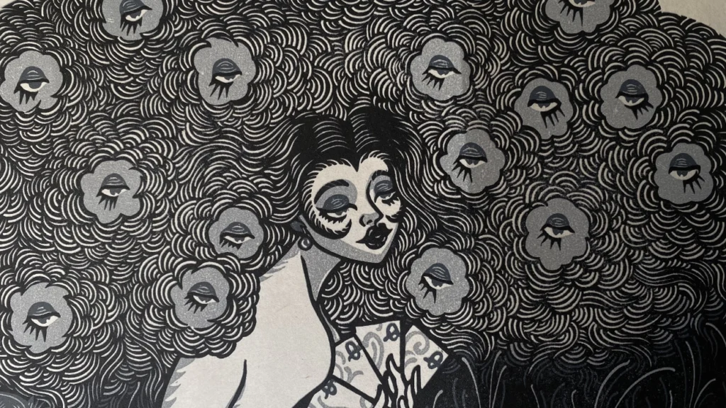 face of a woman with a languid look and her hair full of flowers