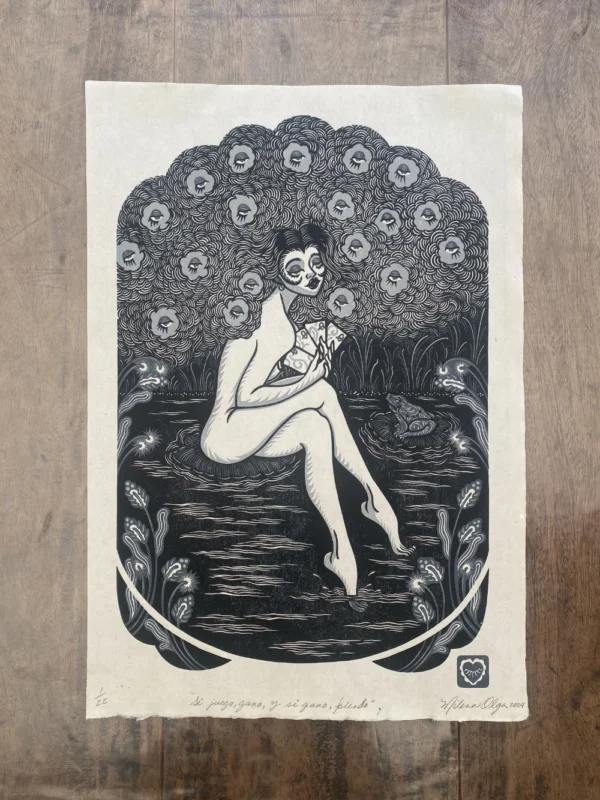 printed sheet of a linocut reduction of a woman sitting on a pond looking holding a set of cards and a frog looking at her, her hair is curly and full of flowers with eyes.